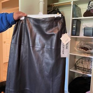 Black leather long straight skirt.  Perfect with boots!